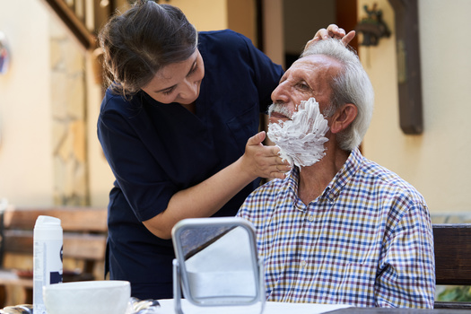 A 2021 AARP report estimates the hourly economic value of unpaid family caregiving in Indiana at $14.61, and those hours add up to $10.8 million per year. (Adobe Stock)