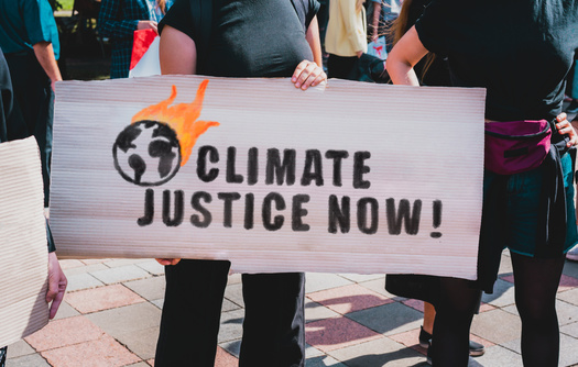 Some climate scientists argue that breaking away from fossil fuels as soon as possible could stave off a global climate catastrophe. While many utility companies have made such pledges, they argue the transition won't be easy because of current energy demands. (Adobe Stock)