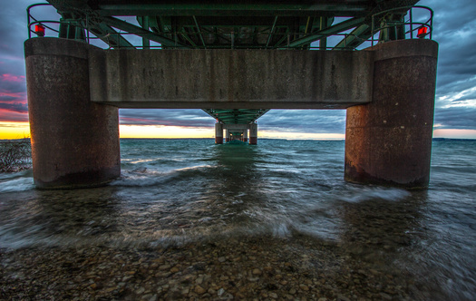 View from underneath of the Mackinac Bridge in Michigan, one of the longest suspension bridges in the world. (ehrlif/Adobe Stock)