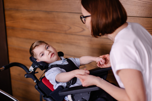 In the midst of personal stories of dedication and sacrifice, the fate of family caregiving services now rests on the outcome of a critical public comment period, as Indiana parents strive to secure continued support for the unique needs of their children. (Adobe Stock)