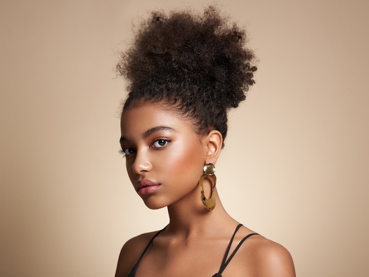 Black Americans have lost their jobs or had job offers revoked because of hair discrimination, according to the Legal Defense Fund. (Adobe Stock)