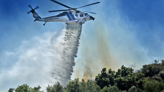 Santa Barbara County Fire Department's Firehawk is shown making a water drop. It can hold 1,000 gallons per trip. (Mike Eliason/Santa Barbara County Fire Dept.)