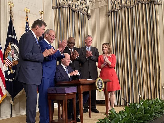 Sen. Joe Manchin, D-W.Va (far left), and other lawmakers join President Joe Biden as he signs the Inflation Reduction Act into law on Aug. 16, 2022. (Energy Secretary Jennifer Granholm/Wikimedia Commons)