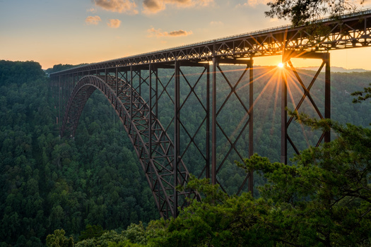 The New River Gorge Bridge in West Virginia. In 2023, the U.S. Forest Service and AmeriCorps signed a five-year agreement to establish the Forest Corps, to create job opportunities that reduce wildfire risk, support reforestation and make national forests and grasslands healthier and more resilient. (Adobe Stock)