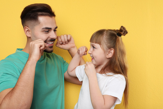 Dentists say daily flossing is key for avoiding the development and progression of periodontal disease. (NewAfrica/Adobestock)