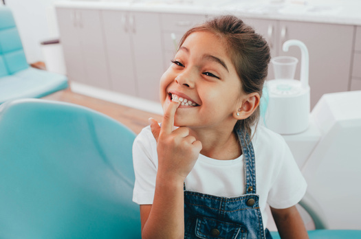 According to the Centers for Disease Control and Prevention, children from low-income families are twice as likely to have cavities in their teeth as those from higher-income families. (Adobe Stock)