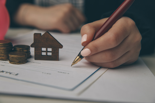 Consumer website Bankrate says scammers typically target a property that does not have a mortgage or lien against it, or is vacant and not closely monitored. (Adobe Stock)