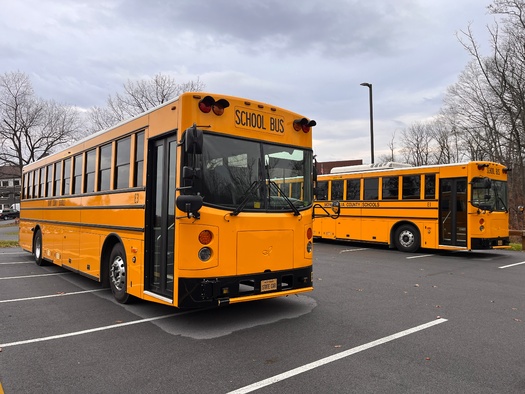 Because of their large batteries, electric school buses can be used as backup power sources for utilities when they are not in use during the summer. (Adobe Stock)