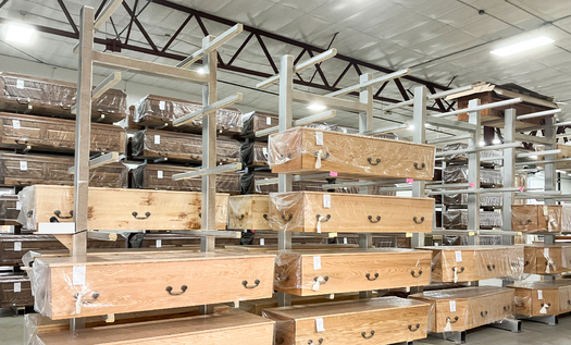 Trappist caskets await shipping on racks in the monastery's Peosta, Iowa, warehouse. (Ann Thomas/Arts Midwest)