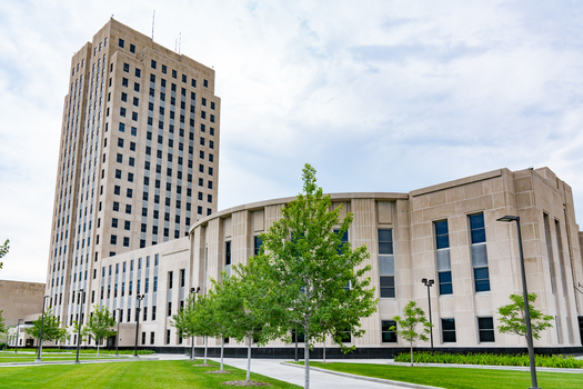 U.S. researchers said there is a belief that boosting lawmaker pay might lead to more working-class legislators, but their information gathering does not back that up. North Dakota lawmakers are part-time, only meeting in Bismarck every other year. (Adobe Stock)