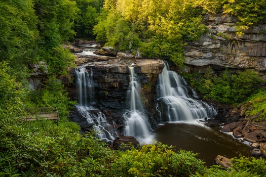 Blackwater Falls in Blackwater Falls State Park attracts visitors who spend more than $25 million in the region yearly, according to West Virginia State Parks. (Adobe Stock).