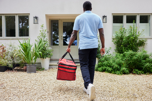 Seattle's ordinance requiring a minimum wage for app delivery drivers is one of the few in the country. (Daisy Daisy/Adobe Stock)