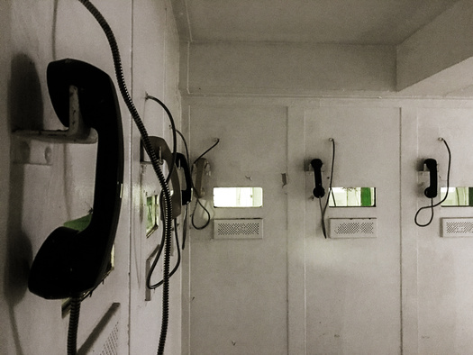 Advocates said people in detention have come to depend on free phone access while navigating the isolation and deprivation behind bars. (R/Adobe Stock)