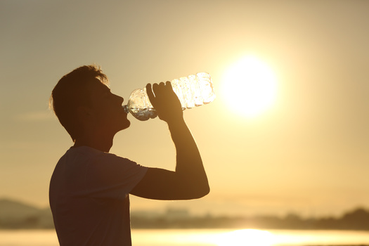 The Centers for Disease Control and Prevention recommends drinking 8 ounces of water every 15 to 20 minutes when doing strenuous activity outside, which translates to 24 to 32 ounces per hour. (Adobe Stock)