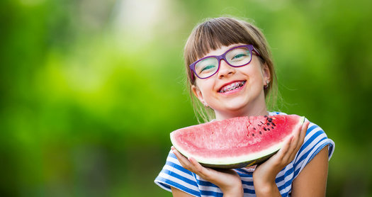 Researchers said children who live in poverty lose an additional two months of reading skills over the summer, with a lack of proper nutrition serving as a key factor. (Adobe Stock)