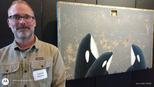 Artist Gabriel Newton used acrylic on found wood to paint Southern Resident orcas, which feed in the Salish Sea. (John Rosapepe/Endangered Species Coalition)