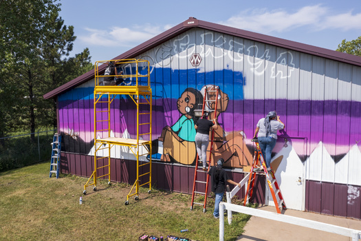 Kids are invited to paint skateboards during the festival, one of many events at RedCan that complements the murals painted by visiting artists. (Cheyenne River Youth Project)