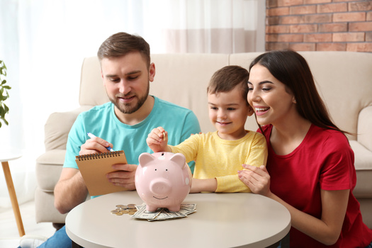 A joint tax return is required for married couples to claim the Child and Dependent Care Enhancement Tax Credit at the end of the tax year. (New Africa/Adobe Stock)