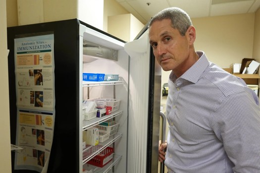 Childhood vaccines are stored in temperature-controlled refrigerators at pediatrician Eric Ball's practice in Orange County, Calif. (Jackie Fortir/KFF Health News)