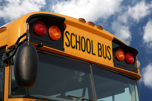 Bus drivers and other classified staff in Washington schools are struggling with the high cost of living the state. (Julianna Olah/Adobe Stock)