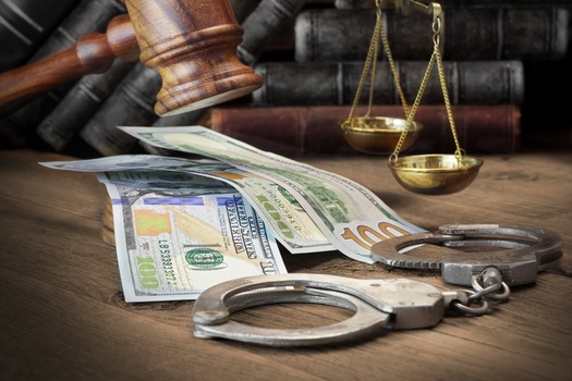 A report from the Brennan Center for Justice emphasized cash bail often allows release based on financial resources rather than public safety considerations. (Adobe Stock)
