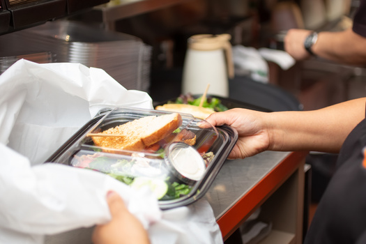 Restaurants and food businesses in the U.S. use nearly 1 trillion pieces of disposable plasticware and packaging annually, according to Upstream, a reuse advocacy organization. (Adobe Stock)