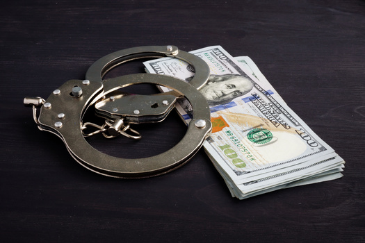 A report from the Brennan Center for Justice emphasized cash bail often allows release based on financial resources rather than public-safety considerations. (Vitalii Vodolazskyi/Adobe Stock)