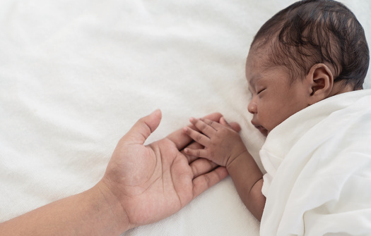This year, the North Carolina Maternal Mortality Review Committee reported bias and discrimination contribute to traumatic and near-death experiences. (Adobe Stock) 