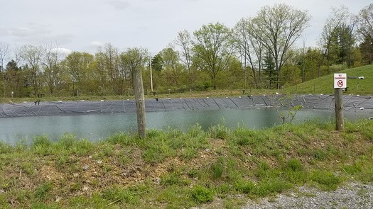 A fracking waste impoundment pond site. Research shows radioactive waste from fracking can spread to groundwater. (FracTracker/Flicker) 