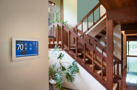 Federal officials said by embracing energy-efficient upgrades, such as a smart thermostat, a single eligible household can enjoy savings of up to $14,000. (Adobe Stock)