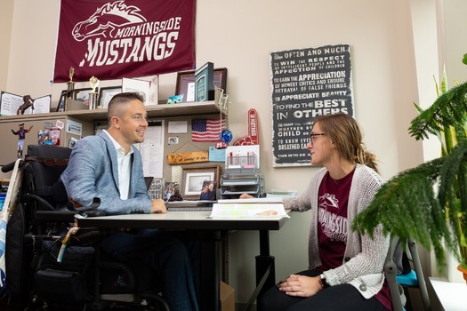 Alex Watters works at Morningside University in Sioux City, Iowa. He says he's had to turn down promotions and other opportunities to keep his income below the threshold that allows him to receive benefits as a quadriplegic. (Alex Watters/IDDC)