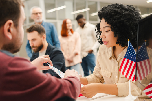 Civil rights experts said for newly naturalized Americans voting for the first time, the process can be intimidating, prompting calls for outreach so everyone knows their rights when casting a ballot. (Adobe Stock)