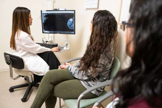 Breast surgical oncologist Tran Ho, DO, FSSO, speaks with a patient at El Camino Health about her mammogram. (El Camino Health)