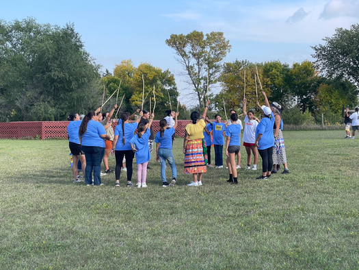 Adults and youth get ready to play double ball during the first annual Indigenous Dakota Games event in Lake Traverse Reservation. (Dustina Gill)