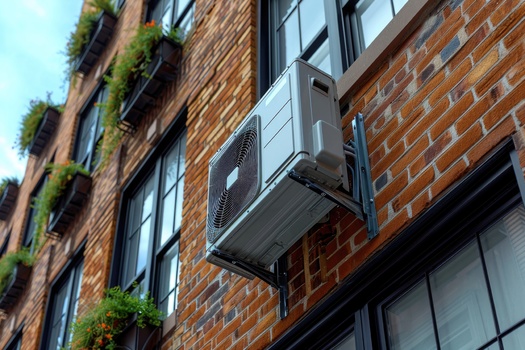 Air-source heat pumps use two to three times less energy than electric resistance heating. (Adobe Stock/AI)