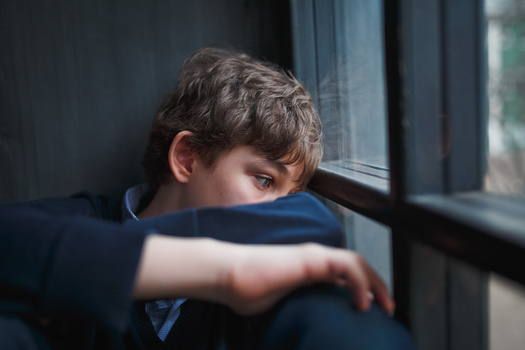 The Illinois Department of Health lists witnessing violence in the home or community or having a family member attempt or die by suicide as examples of adverse childhood experiences. (Adobe Stock)