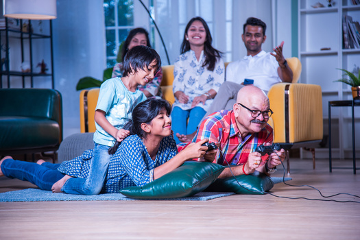 The Pew Research Center says the rate of multigenerational households in the United States has quadrupled since 1971. Some in the academic community say that overlaps with the need for individuals to be more socially conscious about how they share their money. (Adobe Stock)