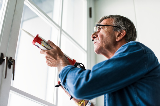 Use caulk, spray foam and weather stripping to keep more heat inside the home. (Rawpixel.com/Adobe Stock) 