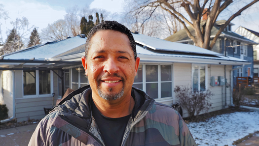 Jacques Beech saw his electric bill fall to $100 a month after installing solar panels on his Minneapolis home. (Photo courtesy Brad Stauffer for Energy News Network)