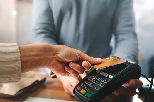 Data from the federal Consumer Financial Protection Bureau show people pay about $9 billion a year in overdraft and NSF fees, costing an average of $150 a year for families that pay these fees. (Jacob Lund/Adobe Stock)