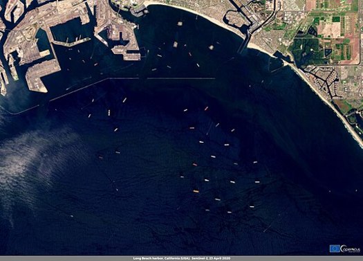 Oil tankers, such as these near the port of Long Beach, are part of a debate over which oil company earnings should be taxable in California. (European Union, Copernicus Sentinel-2 imagery/Wikimedia Commons)