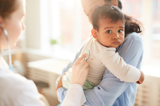 A new report by the Georgetown University Center for Children and Families said proposed cuts in Medicaid funding would cripple Iowa's rural health centers, where many children rely on the program for health insurance. (Adobe Stock)