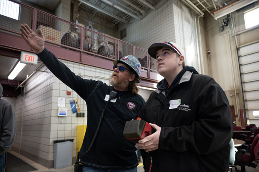 A Minnesota high school student gets an in-person learning experience about aspects of construction work after taking an online elective course now being offered. (Photo courtesy Fair Contracting Foundation of Minnesota)
