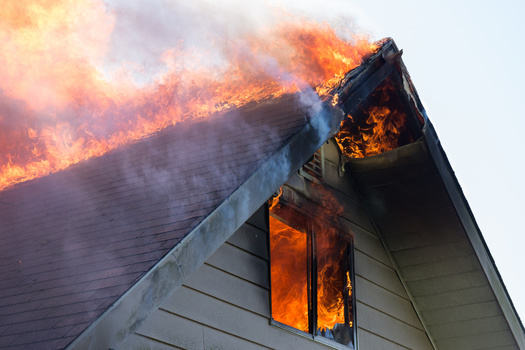 Houses are most likely to catch fire from the top down because of falling embers. (Jamie Hooper/Adobe Stock)