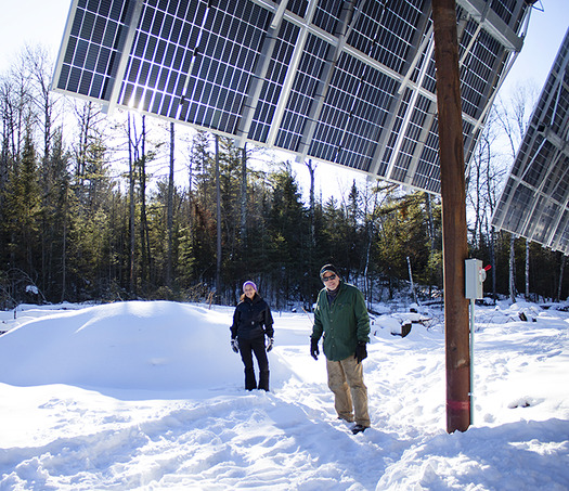 Daniel Houle and Denise Myers stand in front of their new solar setup at the Lodge of Whispering Pines along the Boundary Waters Canoe Wilderness. The system has 72 panels and can generate a total of 38 kilowatts per hour. (Photo courtesy of Ava Kian with MinnPost)