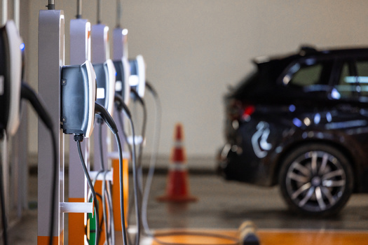 Researchers are developing inductive charging technology that could allow EVs to charge without plugging in, using embedded road or parking pad systems. (Kalyakan/Adobe Stock)