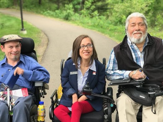 Nikki Villavicencio, center, serves on the Maplewood City Council and is a board chair with the Minnesota Council on Disability. She's part of a coalition of self-advocates warning about the effect Medicaid cuts would have on those with disabilities. (Photo courtesy of Villavicencio)