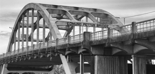 On March 7, 1965, police and state troopers brutally attacked civil rights marchers on the Edmund Pettus Bridge in Selma. Known as Bloody Sunday, the violence left many injured and sparked national outrage, fueling the fight for voting rights. (Nate Blunt/Adobe Stock) 