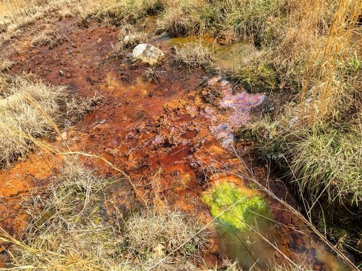 Polluted, acidic water leaving KD #1 Surface Mine on Lens Creek near Marmet. (Kanawha Forest Coalition)