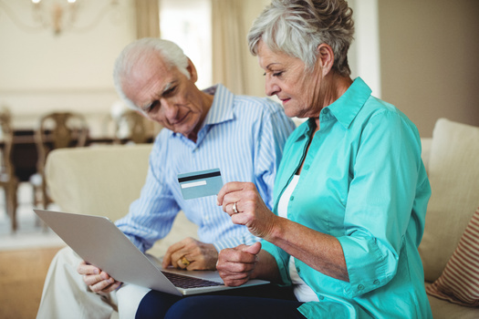 In a new AARP survey, 37% of older adults with credit card debt report their debt level is higher than it was a year ago. (Adobe Stock)